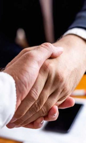 bigstock-Businessman-Handshake-Close-Up-379088089 (1)